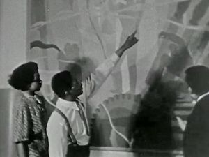 See Aaron Douglas displaying some of his murals