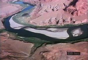 Travel down the erosive Colorado River in Utah to study its ancient geologic footprint and sandbar formation