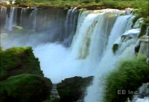 Visit Iguaçu (Iguazú) Falls on the Argentina-Brazil border to see the Iguaçu River plunge over the Paraná Plateau