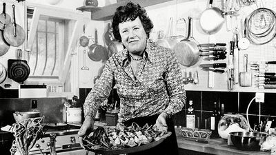 Chef Julia Child displays a salade nicoise she prepared in the kitchen of her vacation home in Grasse, southern France. August, 1978
