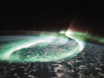 Aurora Australis (the Southern Lights) shows sinous looping band of airglow above the Earth Limb, taken by space shuttle Discovery, May 6, 1991.
