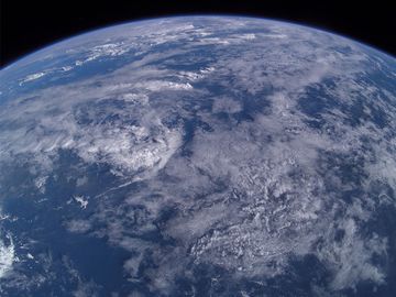 Aerial photo from 380 km over earth from the International Space Station over Mindanao Island group, Philippines. Atmosphere, clouds weather sky, limb of the earth