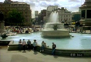 Observe Trafalgar Square and its tribute to Sir Horatio Nelson that symbolizes Great Britain's time as a naval and colonial superpower leading up to the 20th century