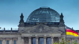 View the city and flying clouds over the sky of Berlin
